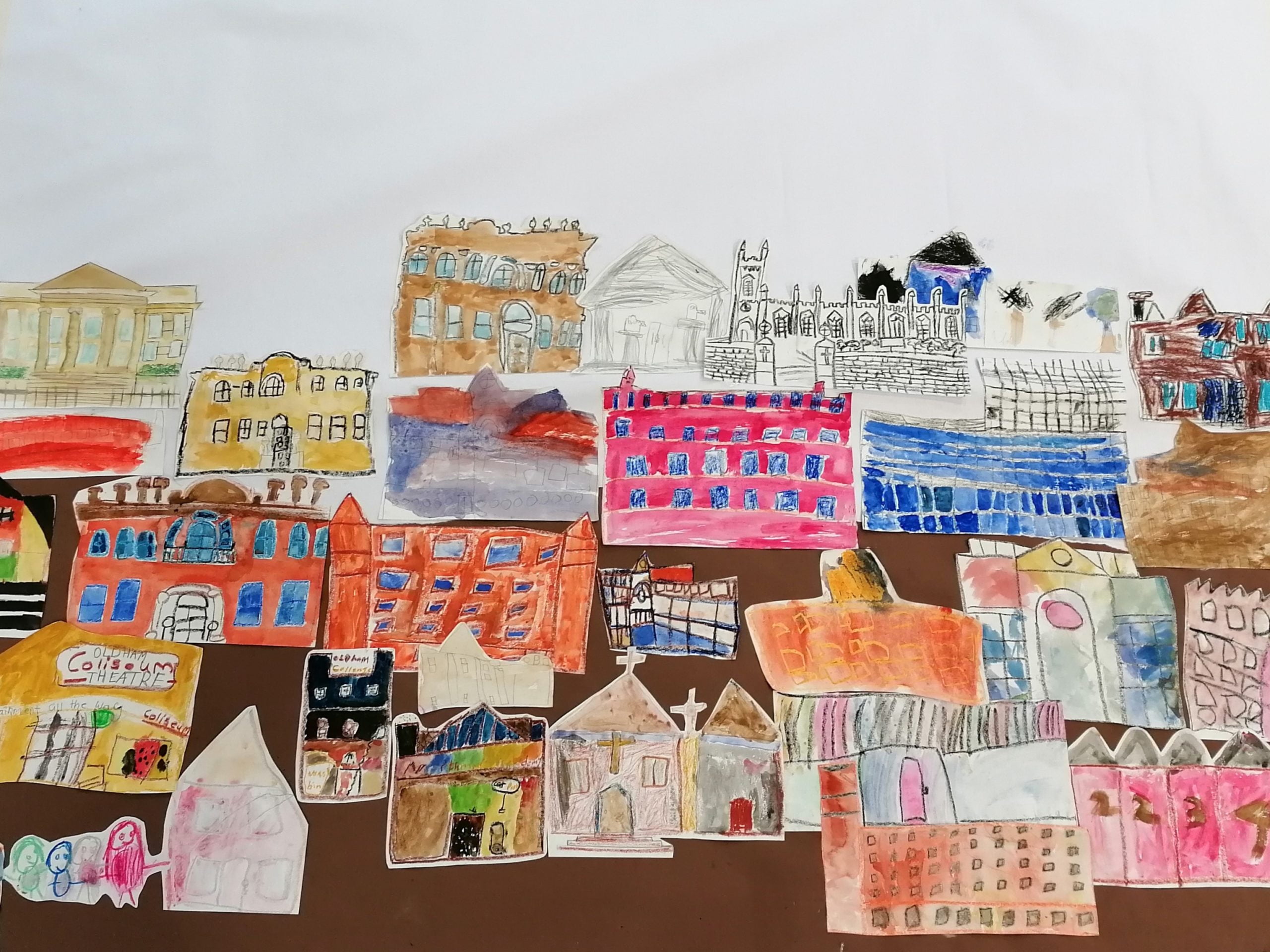 A large-scale artwork of different paintings of buildings in Oldham