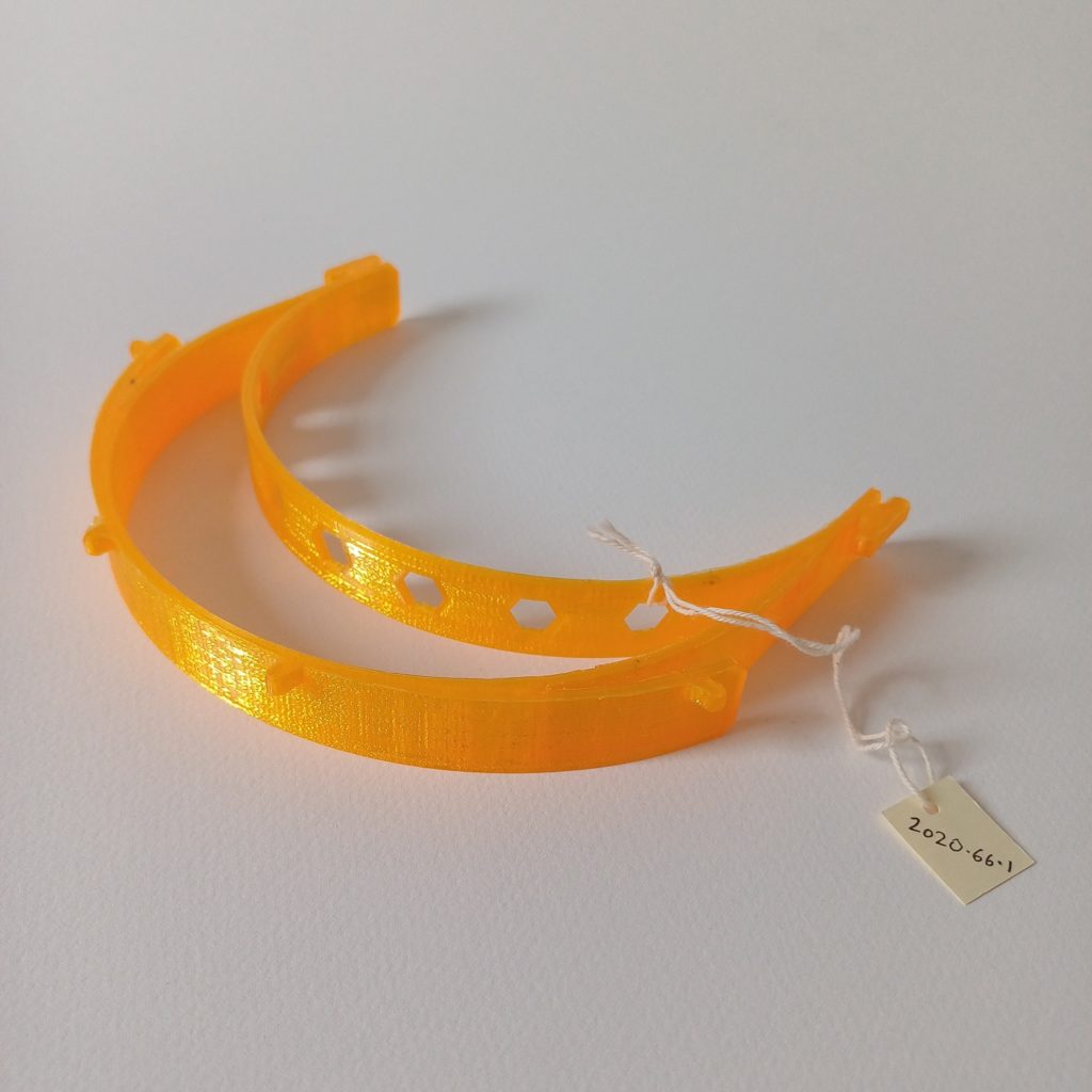 Photograph of yellow 3D printed visor.