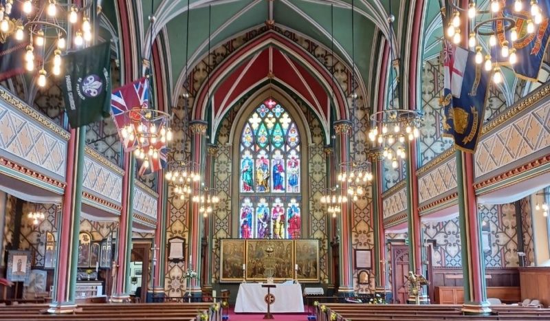 Photograph of the inside of Oldham Parish Church, with the altar in the background centre