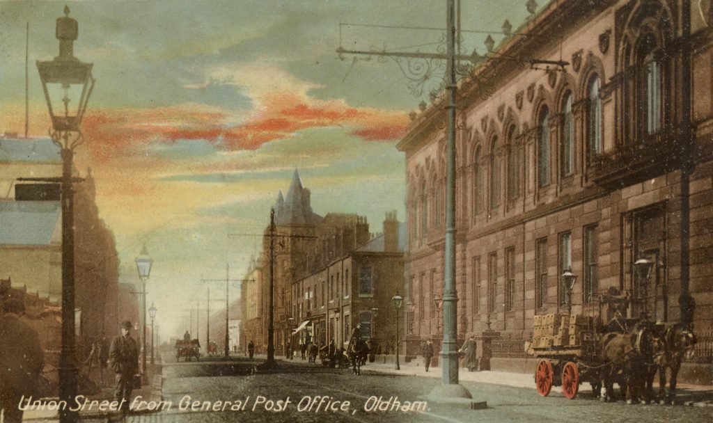 Colour picture postcard showing Union Street in Oldham.