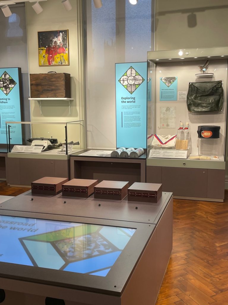 Image showing interactive touch table and museum displays in Oldham and the World Gallery.