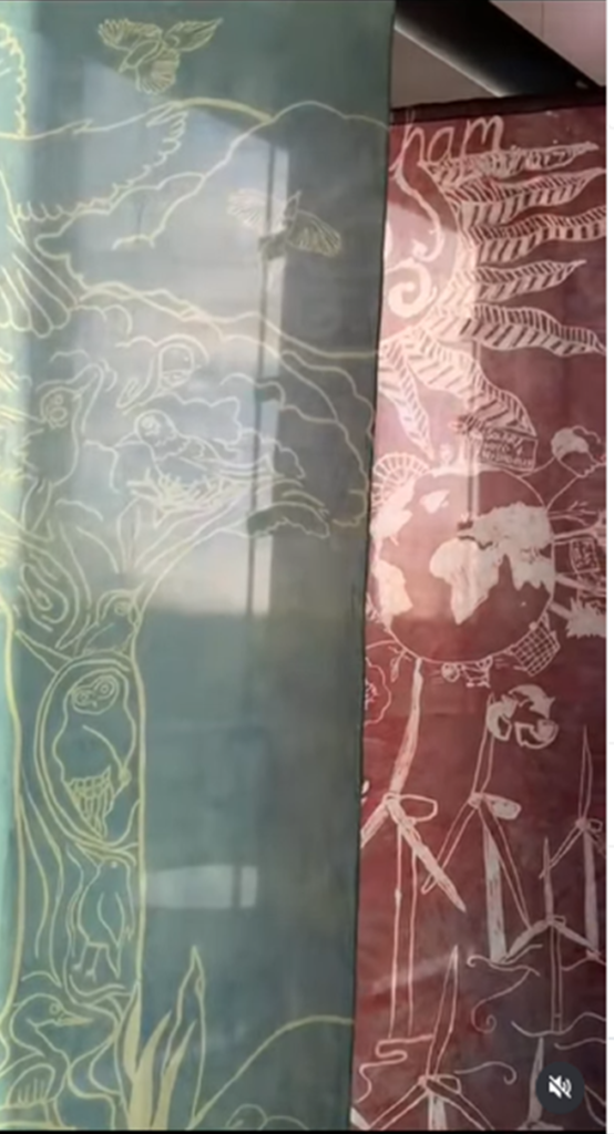 Grey and burgundy coloured and patterned flags